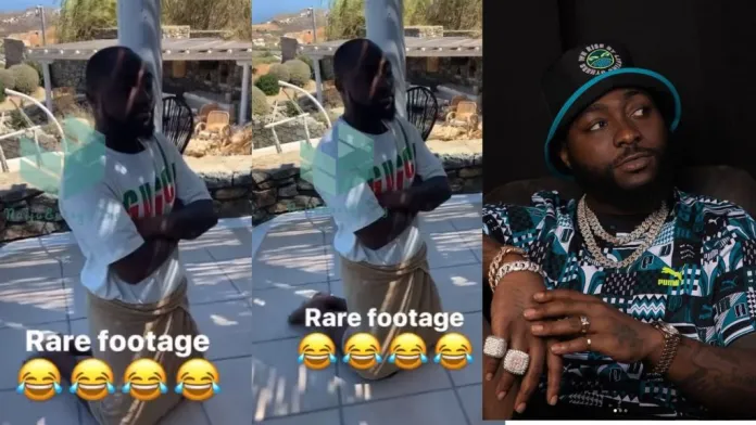 “god abeg ooo” – rare video of davido kneeling down accompanied with a wrapper causes stir online (watch)