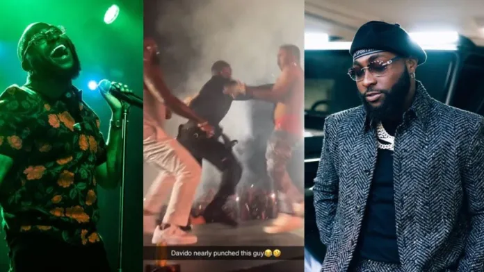 Moment davido nearly punched a fan who intruded during his timeless concert in lagos (video)
