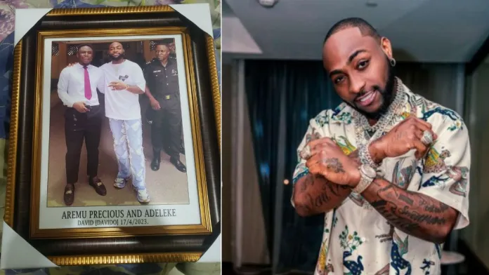 “my great grandchildren must see it” – nigerian man who snapped with davido frames photo, gets many talking